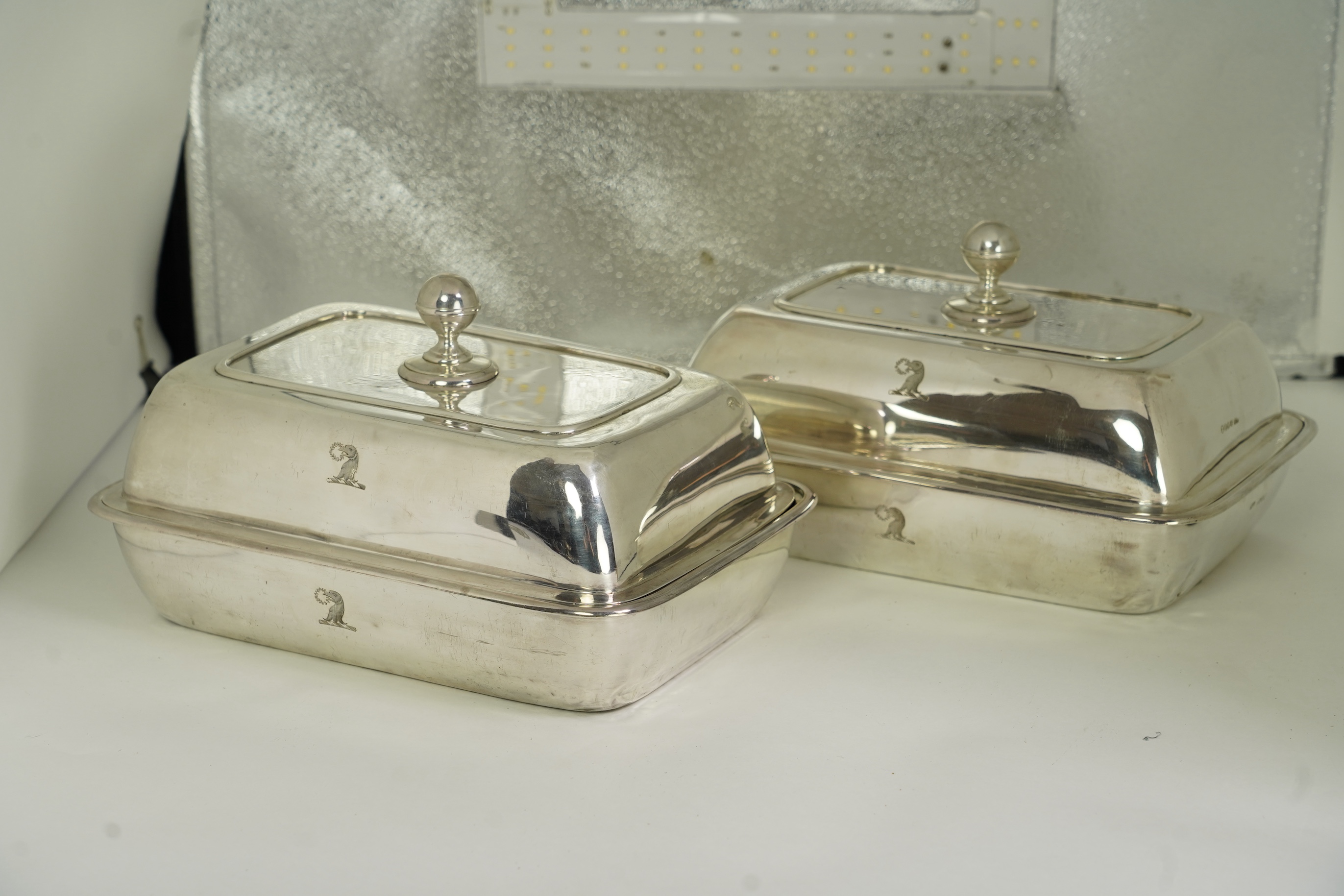A pair of George IV silver entrée dishes and covers with handles, by John Edward Terry, engraved with the Tregonwell family crest